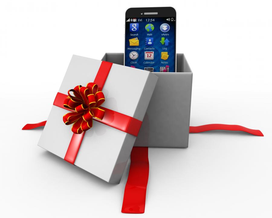 Mobile phone inside a gift box stock photo Slide01